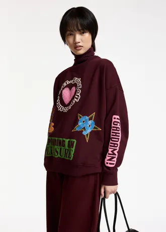 Felpa in cotone con stampa grafica bordeaux e multicolore