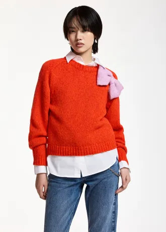 Maglione con fiocco rosso e rosa