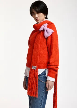 Maglione con fiocco rosso e rosa