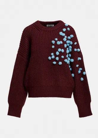 Burgundy and blue sweater with pom-poms