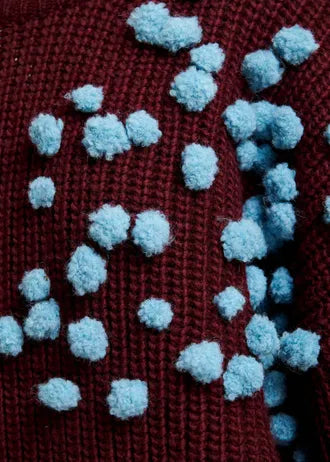 Maglione bordeaux e blu con pompon