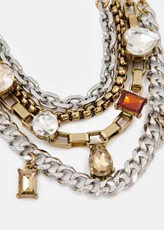 Layered gold and silver chain necklace with gemstones